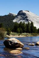 Rocks In Merced River Yosemite National Park With Blue Sky photo