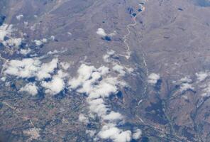Aerial View Of Low Clouds Over Mountains Peru South America photo