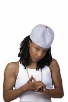 Young Black Woman Baseball Cap White Shirt photo