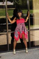 Young African American Woman Outdoors Red Dress photo