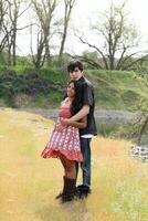 Teen couple boy and girl outdoors full length photo