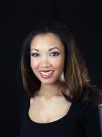 Young black woman smiling with braces on upper teeth photo