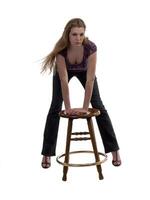 Young Blond Woman Leaning on Stool photo