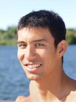 Young mixed man outdoors portrait at river photo