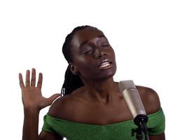 Young black woman at microphone eyes closed photo