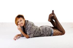 Smiling Asian American Woman Reclining Fishnet Stockings photo