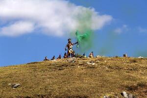 Cusco, Peru, 2015 - Inti Raymi Festival South America Man In Costume With Green Smoke photo