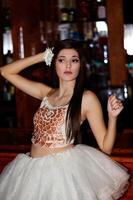 Young Caucasian Woman Standing Indoors In Dance Outfit photo