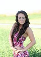 Young teen caucasian girl outdoors in field photo