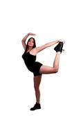 Young teen girl dance pose foot in hand photo