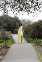 Young Woman Teen Standing on Path Yellow Dress photo