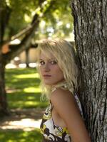 Outdoor Portrait of young blond teen girl photo
