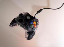 Game Controller With Cord And Shadows photo