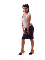 Young hispanic woman heels skirt blouse photo