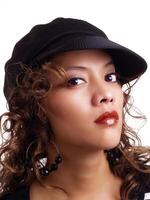 Pretty young hispanic woman wearing black hat photo