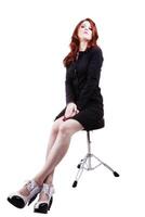 Red Headed Woman In Business Outfit Stool photo