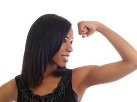 Young black woman showing strength with a smile photo