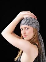 Young woman with scarf hands on head photo