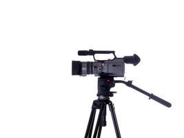 side view of mid-priced video camera on tripod photo