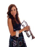 Young woman with brass instrument and mic photo
