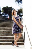 Young Asian American Woman Standing In Dress Outdoors photo