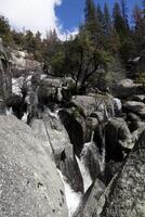 Water Cascading Down Over Granite Rocks Yosemite National Park photo