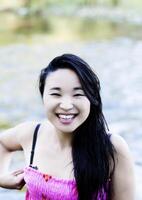 Smiling Attractive Japanese American Woman At River photo