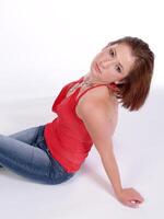 Red top and Jeans Caucasian Woman Sitting photo
