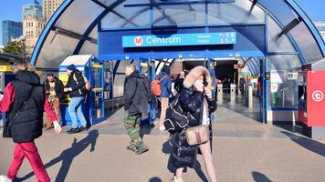 Warsaw, Poland. 7 March 2024. Entrance and exit people in metro station in Patelnia square. photo