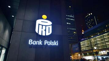 Warsaw, Poland. 6 March 2024. Night view of signage on the facade Pko Bank Polski. photo