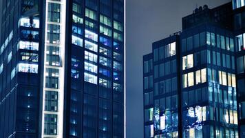 Office buildings by night. Night architectural, buildings with glass facade. Modern buildings in business district. Concept of economics, financial. photo