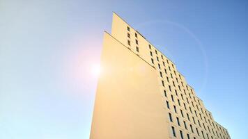 View of a white modern apartment building. Perfect symmetry with blue sky. Geometric architecture detail modern concrete structure building. Abstract concrete architecture. photo