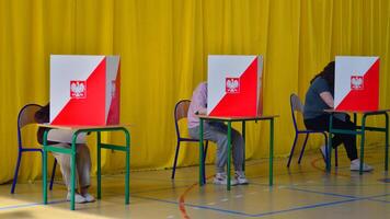 Warsaw, Poland. 7 April 2024. Local elections in Poland. The process of voting at a polling station. photo