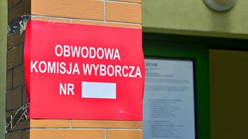 Warsaw, Poland. 7 April 2024. Sign Obwodowa Komisja Wyborcza nr. Polling station. Polish local elections 2024. First round of election. photo