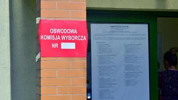 Warsaw, Poland. 7 April 2024. Sign Obwodowa Komisja Wyborcza nr. Polling station. Polish local elections 2024. First round of election. photo