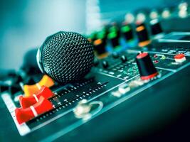 Close-up  microphone on sound mixer in live broadcasting studio producer for sound record control system production and audio equipment and music instrument photo