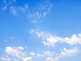 blue sky background with tiny white clouds photo