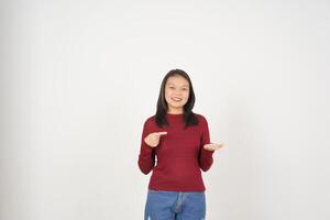 Young Asian woman in Red t-shirt Showing and holding on open palm copy space isolated on white background photo