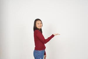 Young Asian woman in Red t-shirt Showing and holding on open palm copy space isolated on white background photo