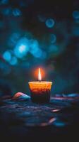 AI generated A small candle emits electric blue flame on wooden table in darkness photo