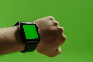 AI generated A mans wrist adorned with a smart watch displaying a green screen photo