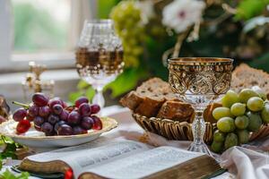 ai generado mesa conjunto con uvas, pan, vino anteojos, y un Biblia para un comida o reunión foto