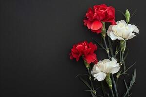 AI generated A stunning bouquet of red and white carnations against a black backdrop photo