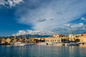 Yachts and boats in picturesque old port of Chania, Crete island. Greece photo