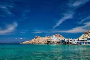 The beach of Firapotamos in Milos, Greece photo