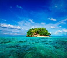 Tropical island in sea photo