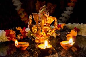 Ganesha with Diwali lights photo