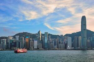 Junk boat in Hong Kong Victoria Harbour photo