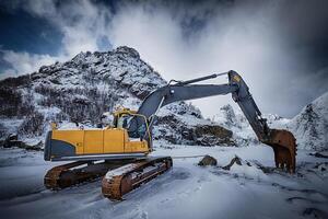 Old excavator in winter photo