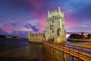 Belem Tower on the bank of the Tagus River in twilight. Lisbon, Portugal photo